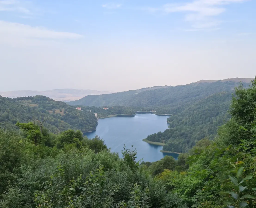 Panoramic view of Lake Goygol and the forested Lesser Caucasus Mountains